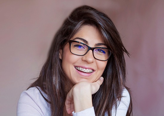 Girl with traditional braces in Glen Ellyn
