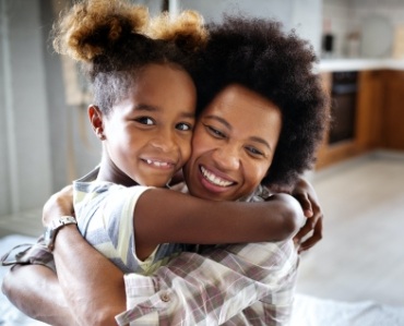 Mother and daughter smiling after preventive dentistry visit