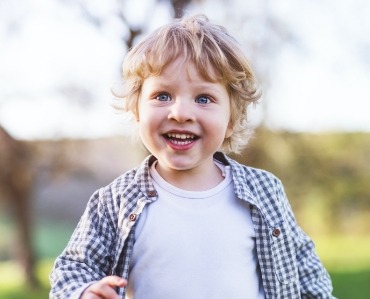 Child smiling after sedation dentistry visit