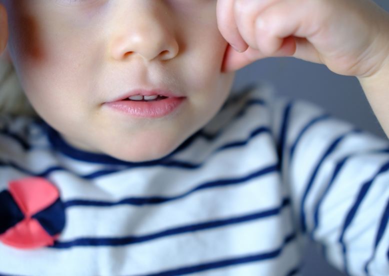 Closeup of toddlers smile after lip and tongue tie treatment