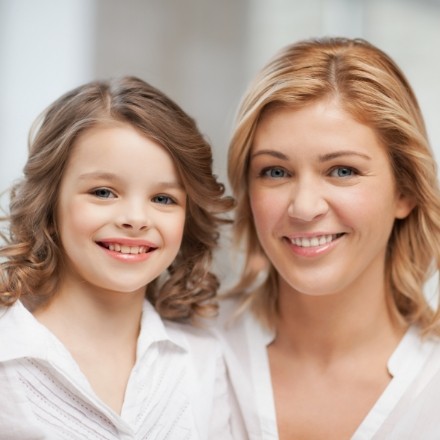 Mother and child smiling after laser frenectomy appointment