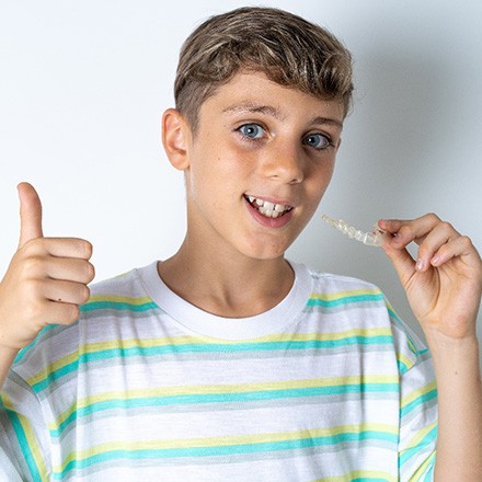 Teen girl with braces posing with her friends