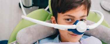 Child receiving nitrous oxide sedation dentistry