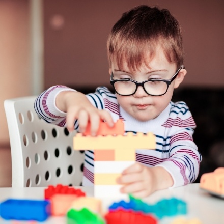 Child playing with blocks before sedation dentistry