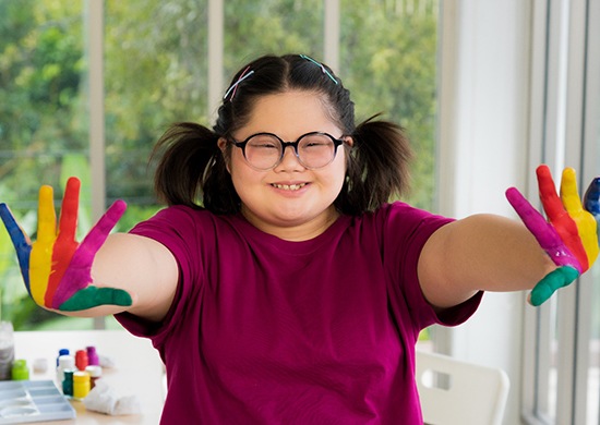 child with special needs smiling after getting special needs dentistry in Glen Ellyn